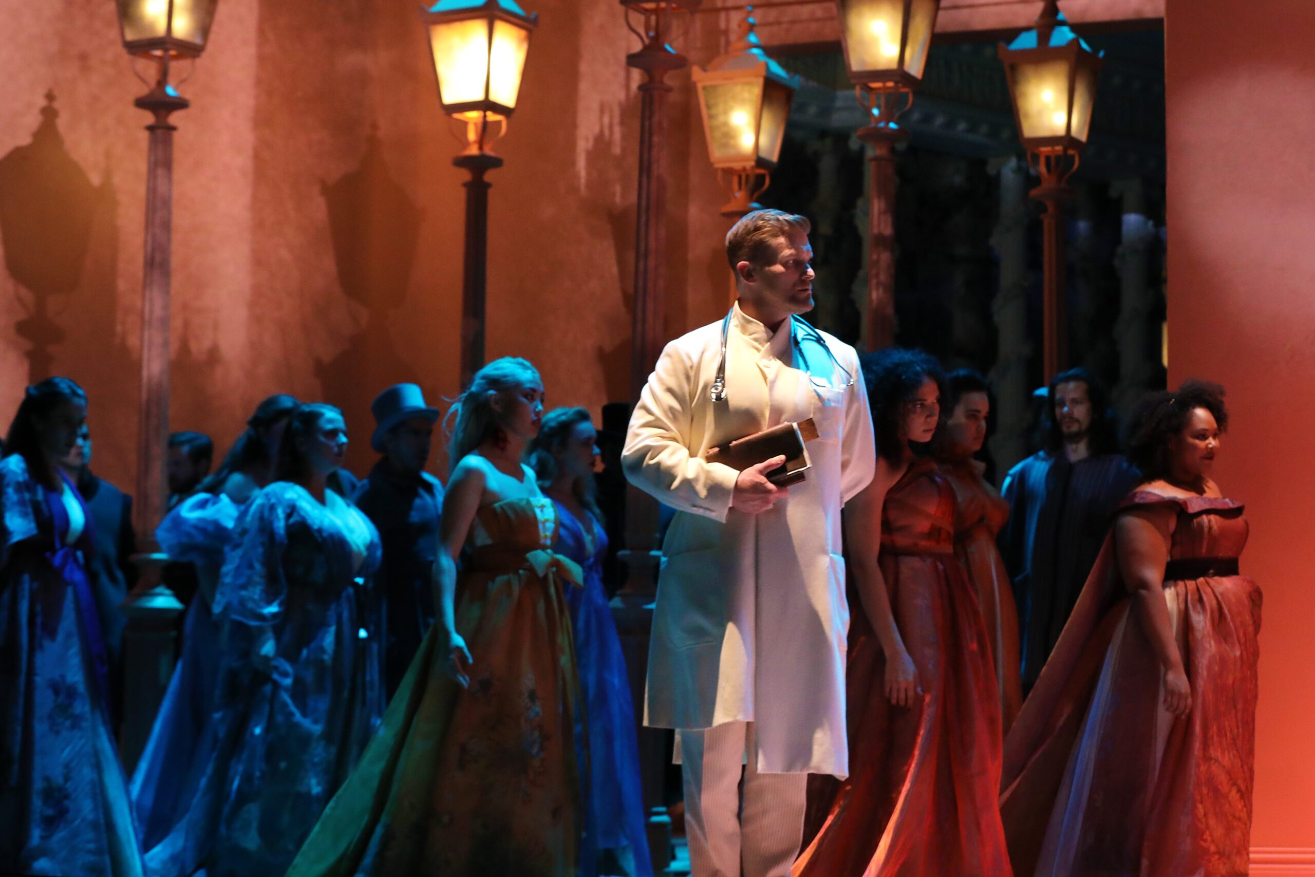 Jarrett Ott (John Seward) and the Santa Fe Opera Chorus. Photo Credit: Curtis Brown for the Santa Fe Opera, 2021