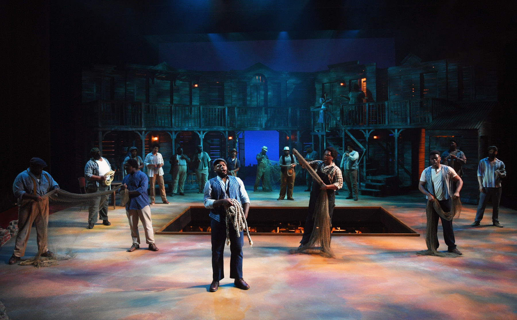 Blake Denson (center) as Jake with the chorus of Porgy and Bess