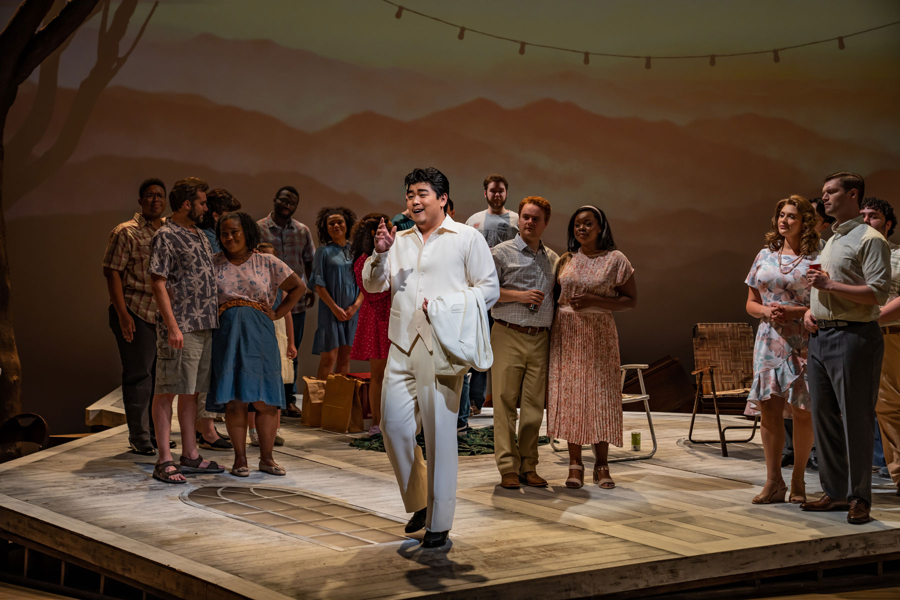 William Guanbo Su as Olin Blitch (center) and the cast of Susannah in Carlisle Floyd's "Susannah." Photo © Jessica Flanigan