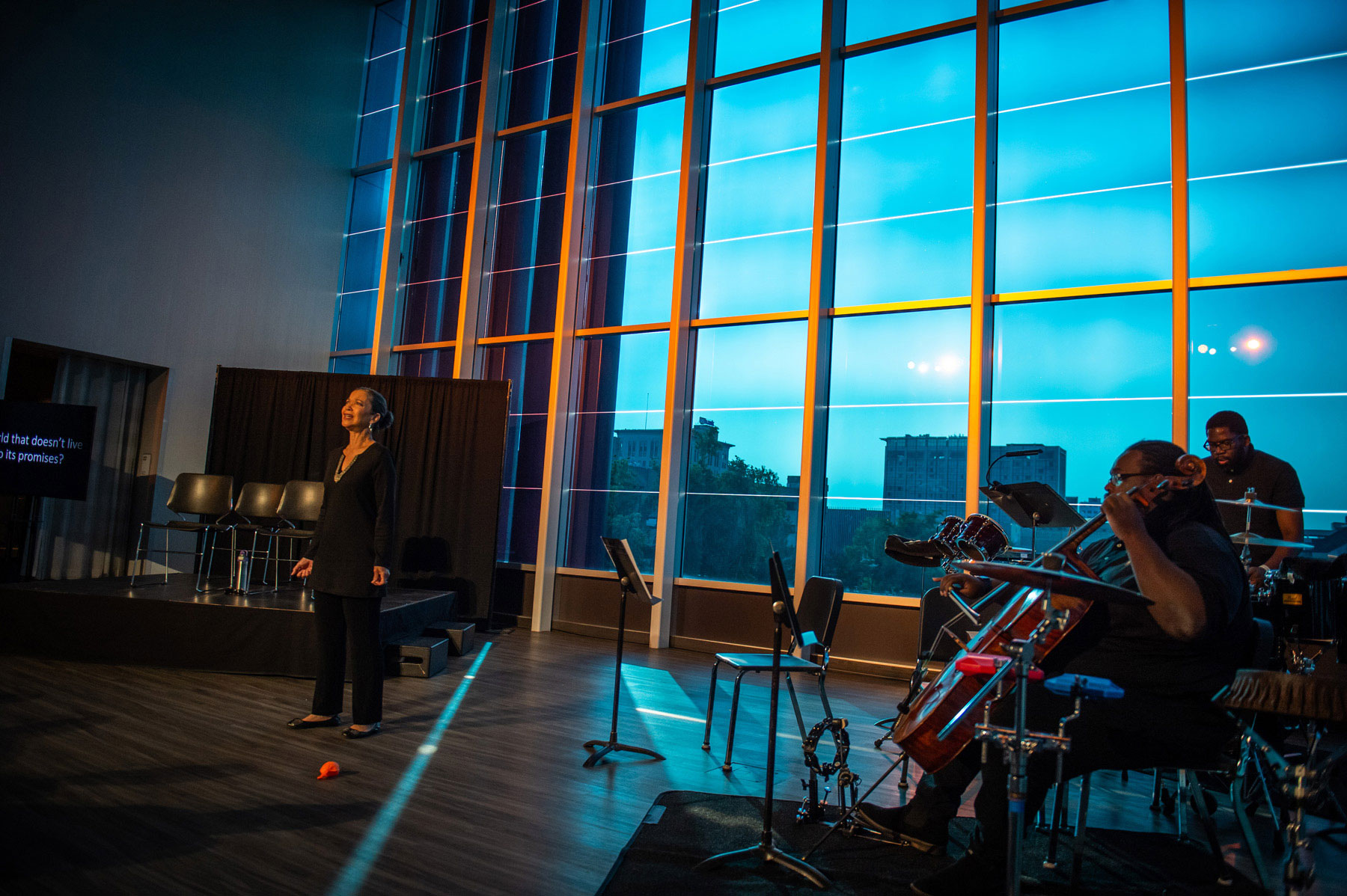 Roberta Gumbel as the Mother with Cremaine Booker (cello) and David Leon Verin (percussion); photo by Luke Behaunek